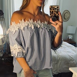 Embroidered flower off the shoulder top